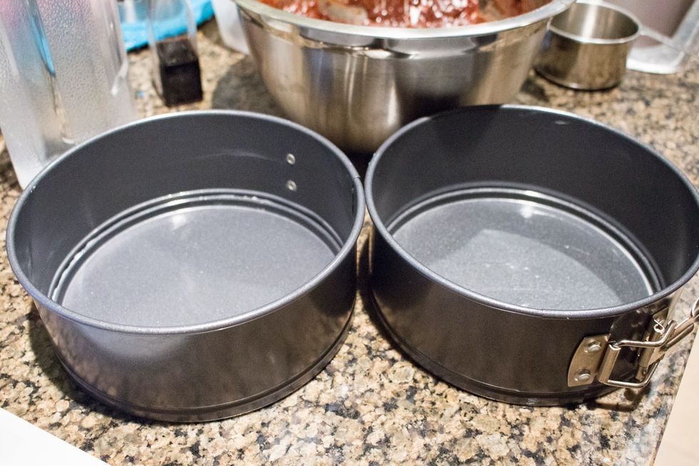 Preheat your oven to 350 degrees F (180 degrees C) and grease your cake pans.