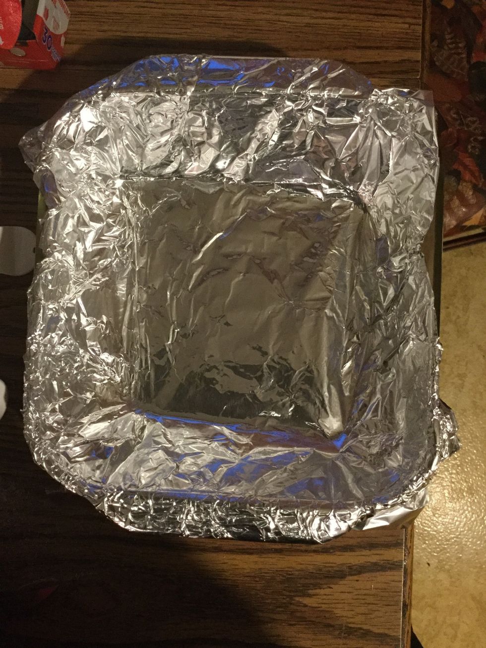 Preheat your oven to 350 degrees Fahrenheit and line aluminum foil in a 9-inch-by-9inch baking dish so that it doesn't stick.