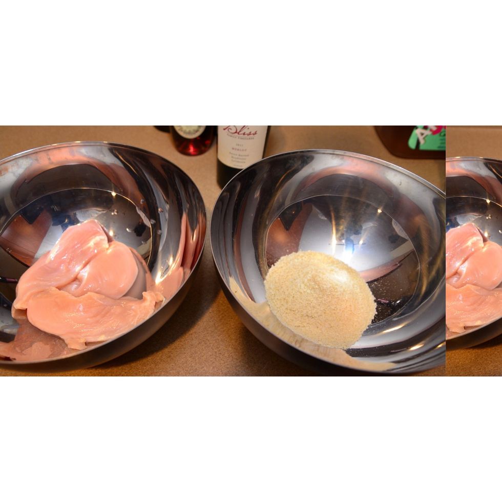 Preheat your oven to 400 degrees. In this photo, chicken breast is rinsed and ready for seasoning. A separate bowl for my crumbled Parmesan mix. 1 cup of breadcrumbs will do the trick.