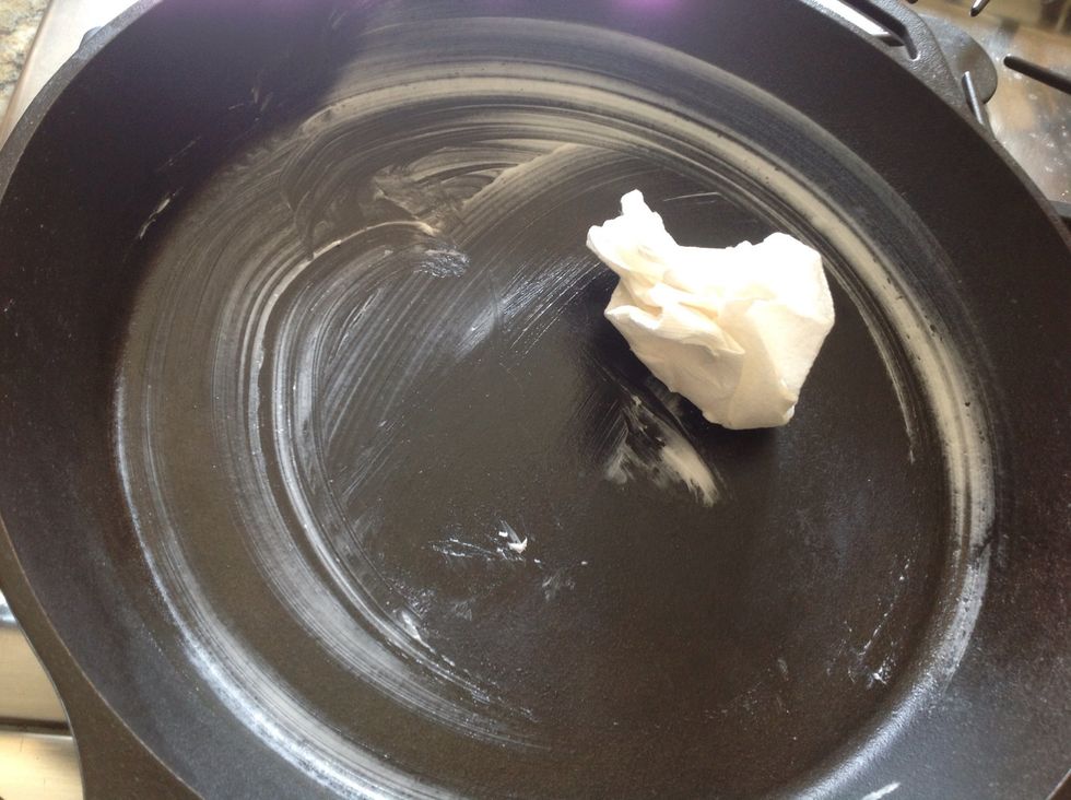 Preheat your oven to 450 and grease your cast iron skillet, if using one, with a paper towel and some shortening. I keep a container of Crisco in the fridge for this. Or spray a cookie sheet with Pam.