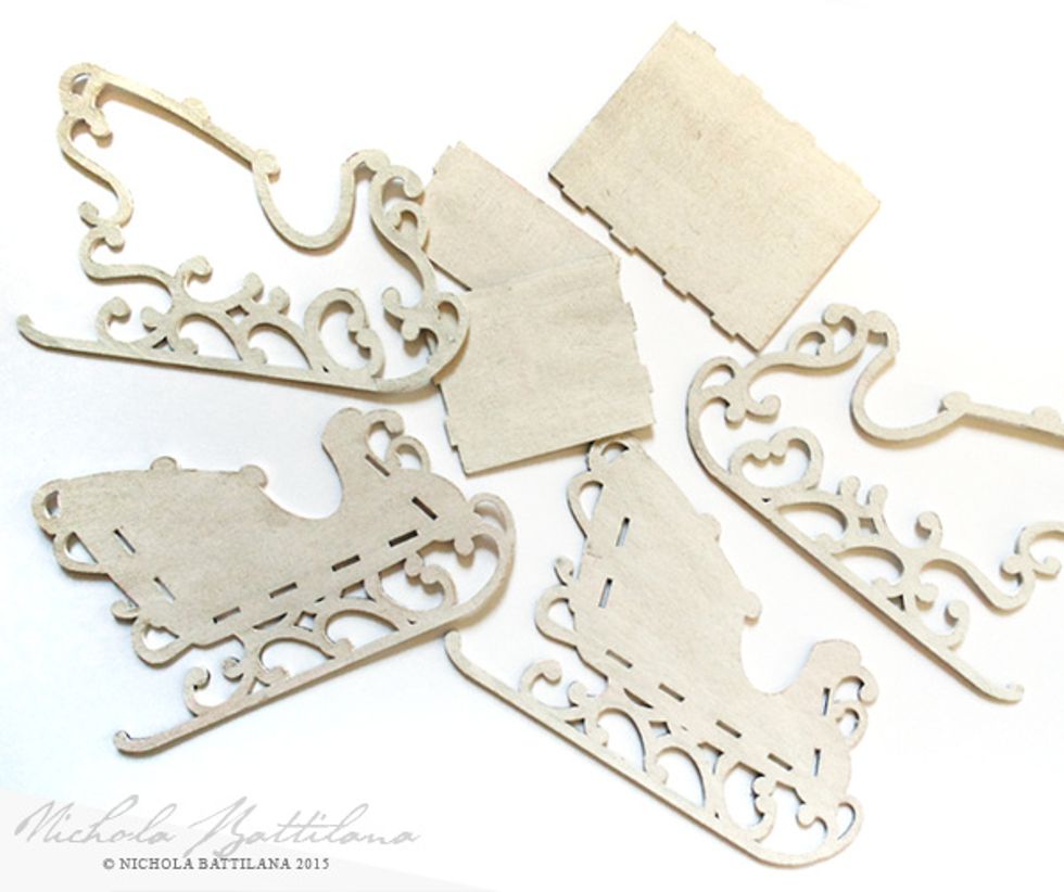 Prep all of your pieces with a coat of white acrylic paint or gesso. You don't have to super neat about it. Just give it a good sloppy coat of paint.