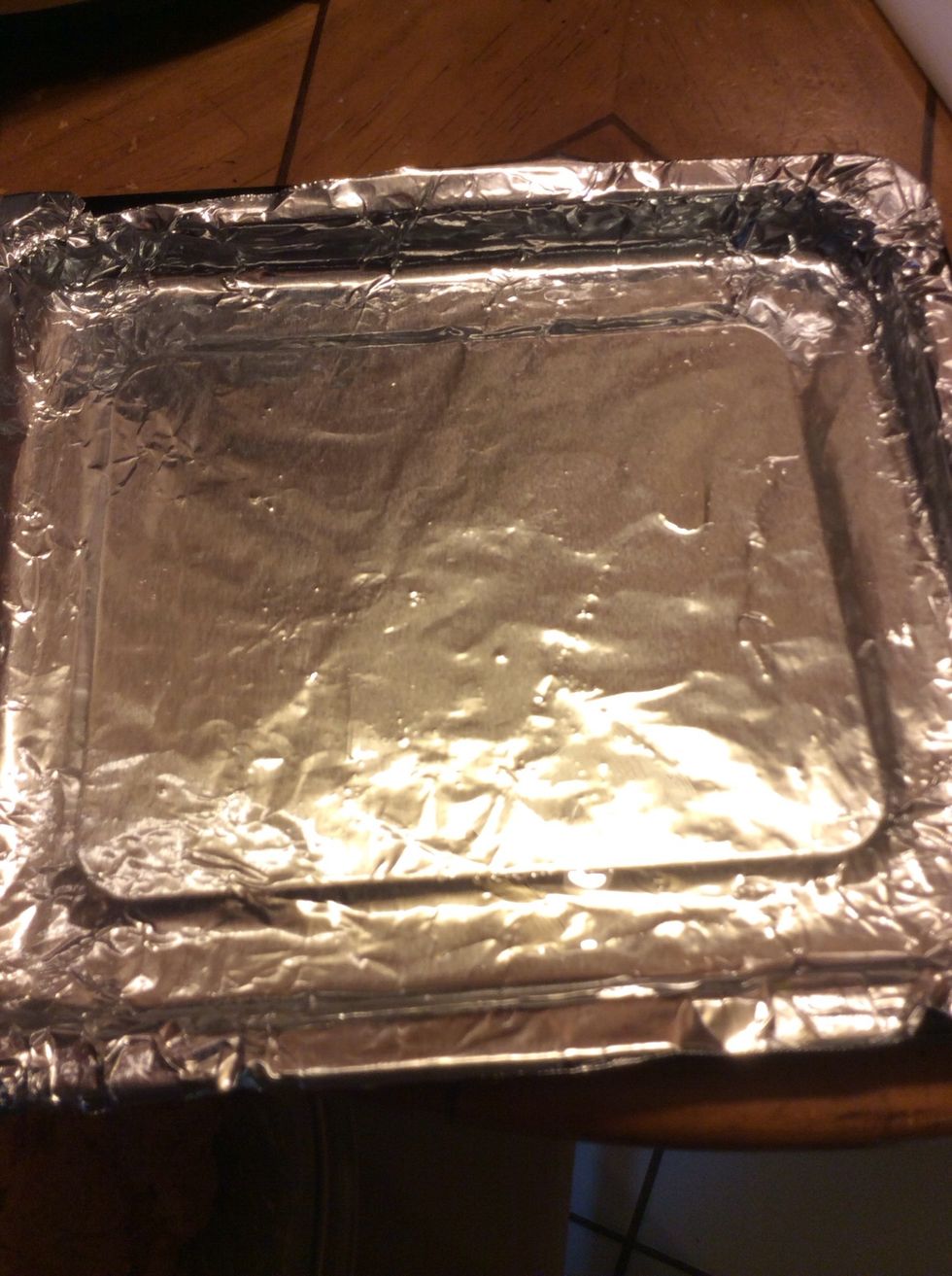 Prep baking sheet; line with aluminum foil and spread oil evenly along bottom.