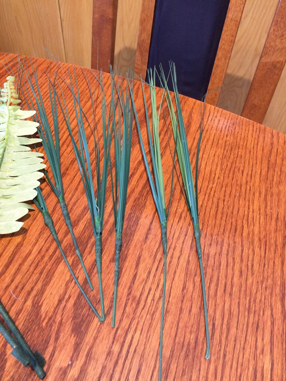 Prep the grass. The ones I have are also two pieces so the sliding piece had to be secured with tape to the stem.