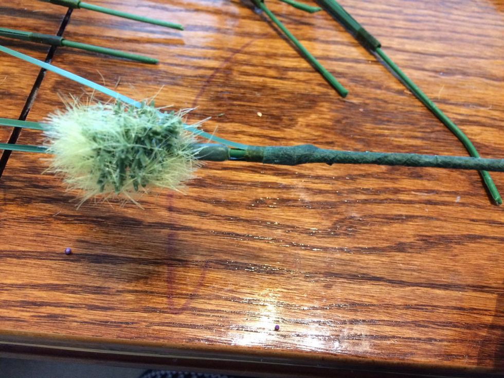 Prep the other cat-tails. I pushed the grass piece right to the top and taped it in place.