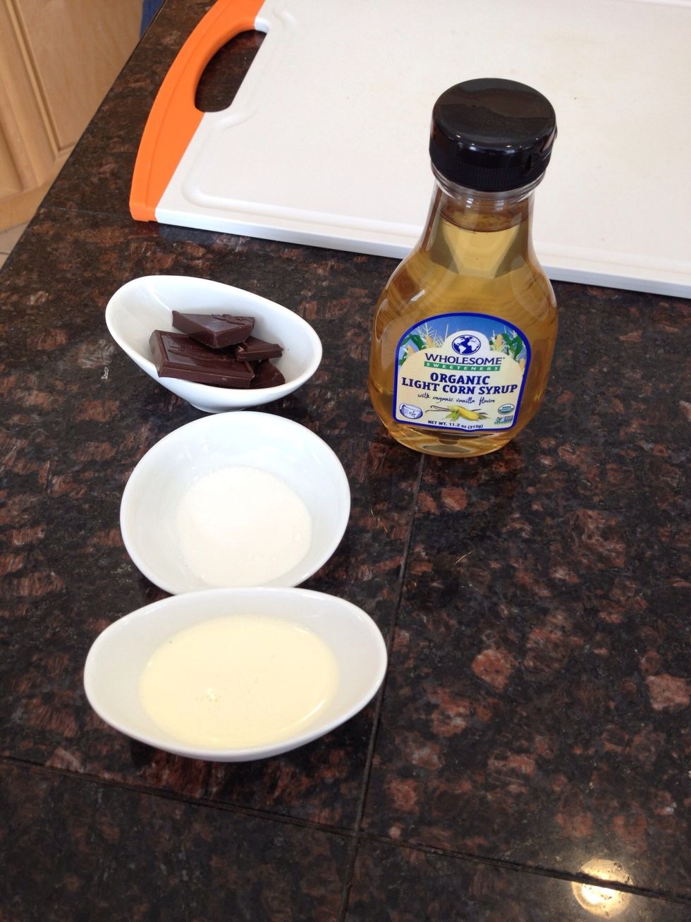 Prep your ingredients. For the chocolate ganache that flavors the whipped cream you'll need two tablespoons of the heavy cream and one ounce of bittersweet chocolate.