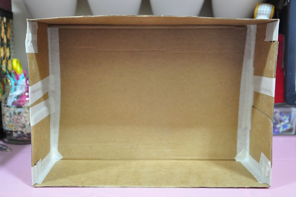 Prep your shoebox. I used masking tape to secure the sides, edges and flaps.