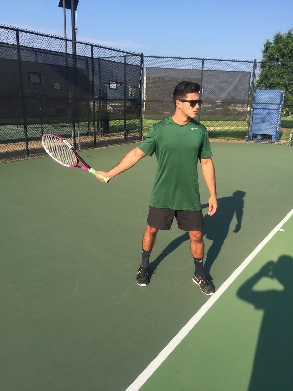 Preparation: Hips and shoulders rotated, placing the side of the body towards the net. Racket is at shoulder level and on the third bevel