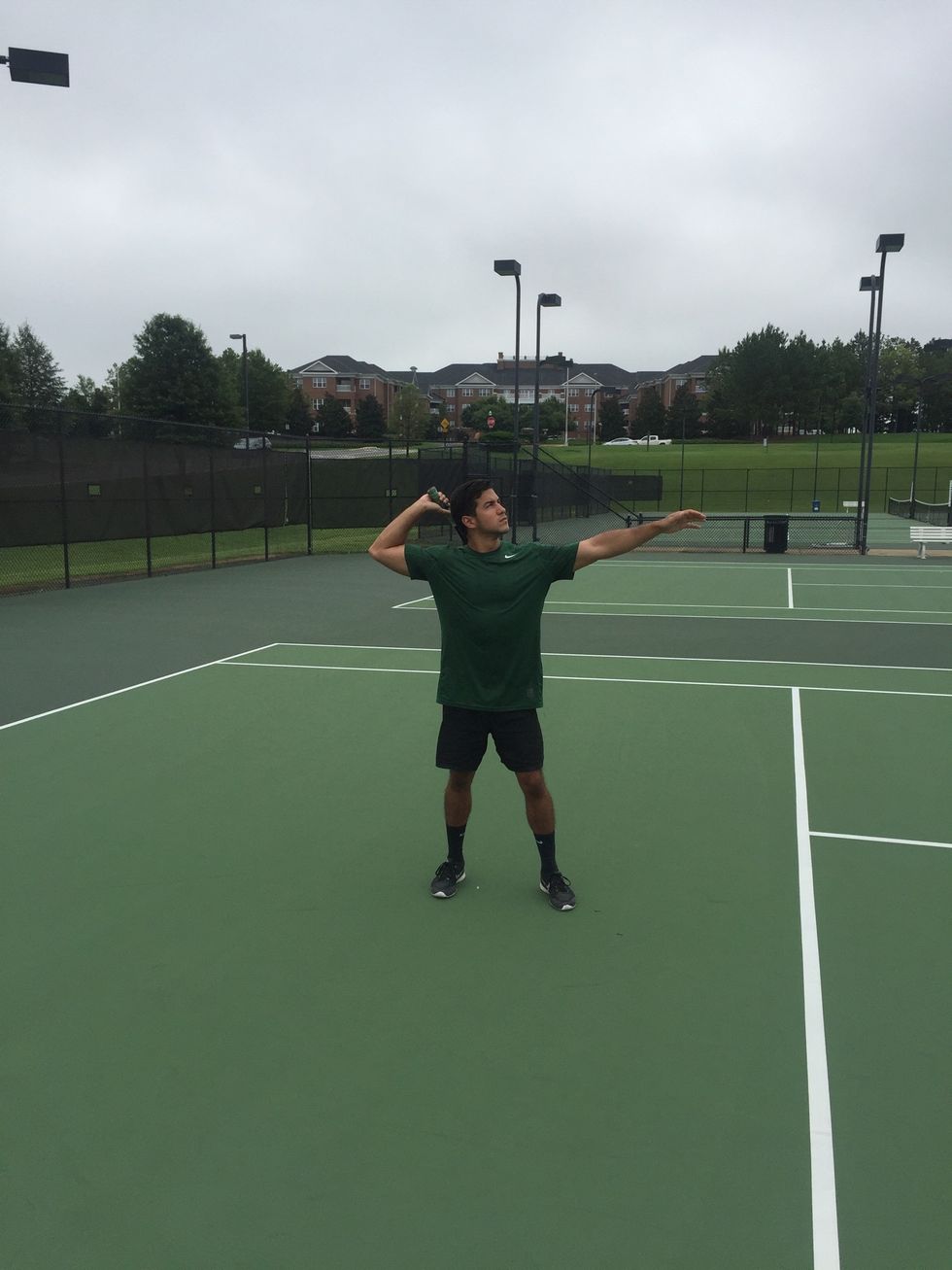 Preparation: place your non-dominant shoulder facing the net about 45-90 degrees. Perform a slightly abbreviated serving motion but don't wind up.