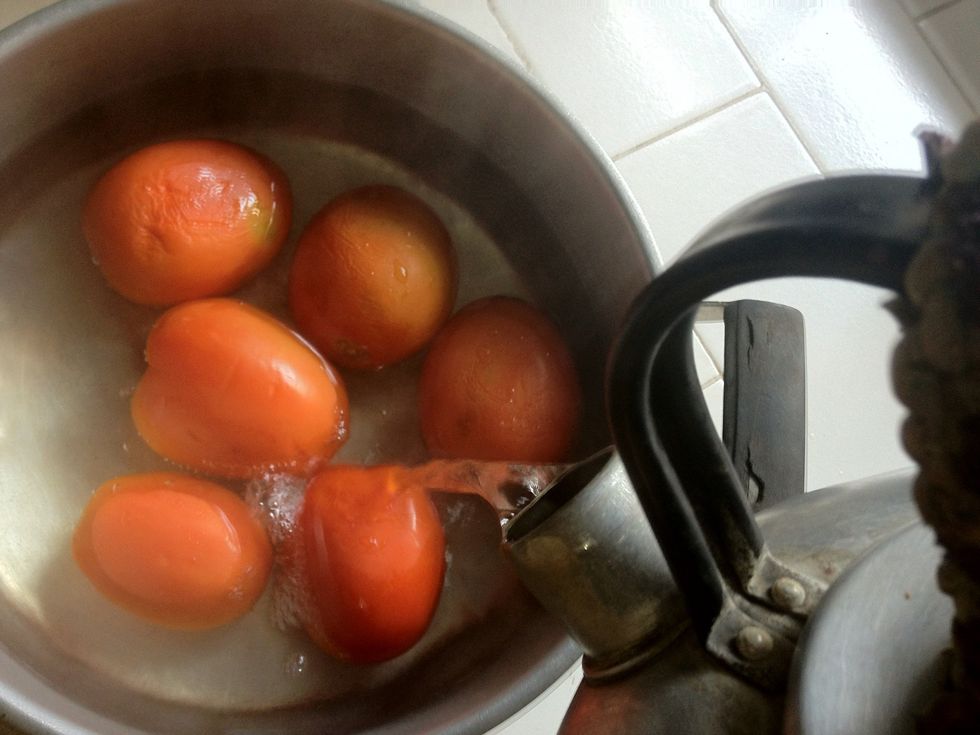 Prepare 500gr of fresh (better ripe) tomatoes in a separate bowl. Bring some water to a boil and add in to the tomato bowl. Cover with the lid and let it sit around 10 mnts until the skin loosen