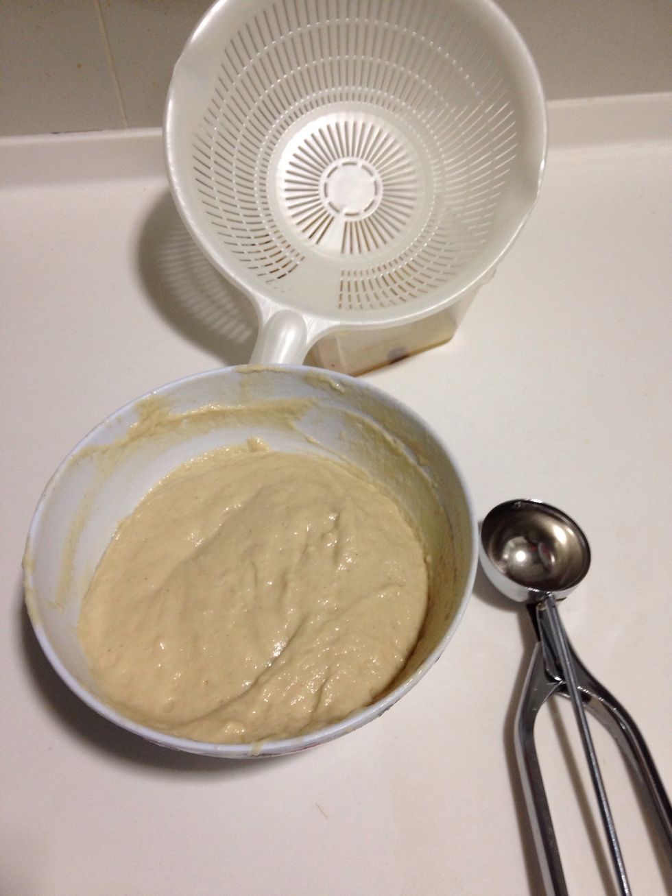 Prepare a colander and ice cream scoop for frying
