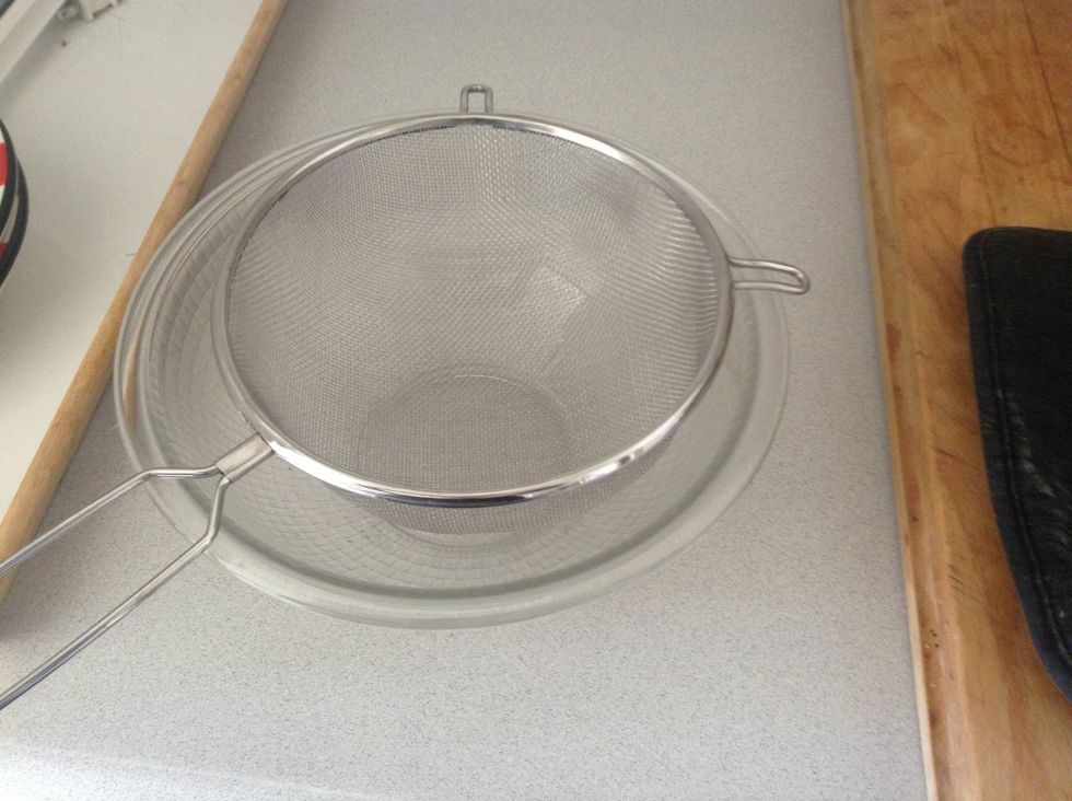 Prepare a filter and a bowl to filter the sauce