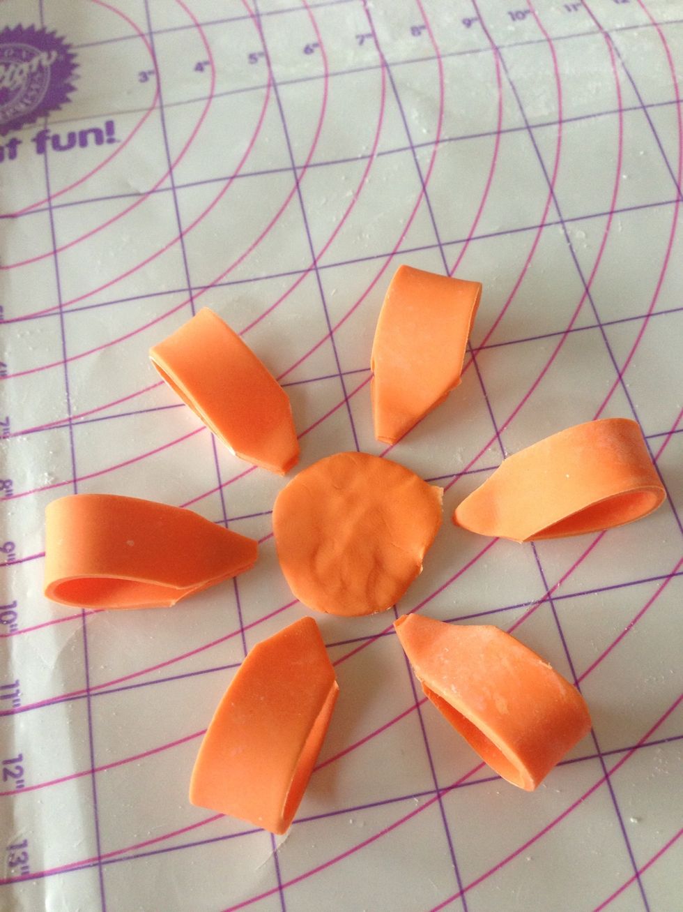 Prepare a flat , circle piece to be a base.