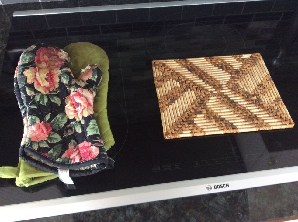 Prepare a hot pad and oven mitts for when it is ready.