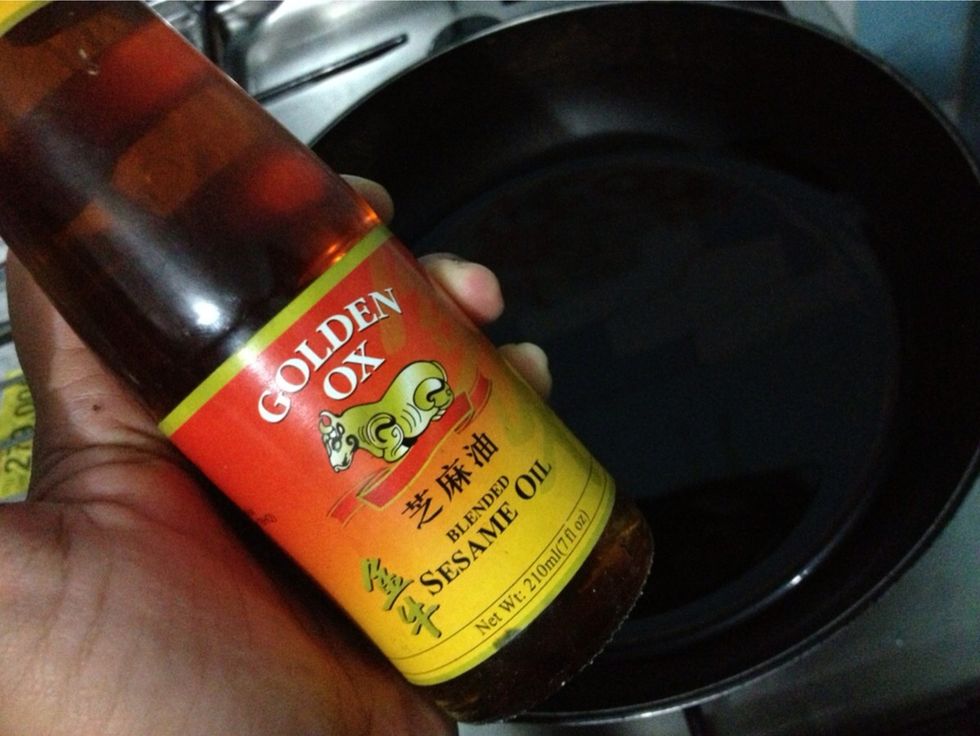 Prepare a sauteing pan. Add in approx 2 tbsp of canola oil and 1 tbsp of sesame oil.