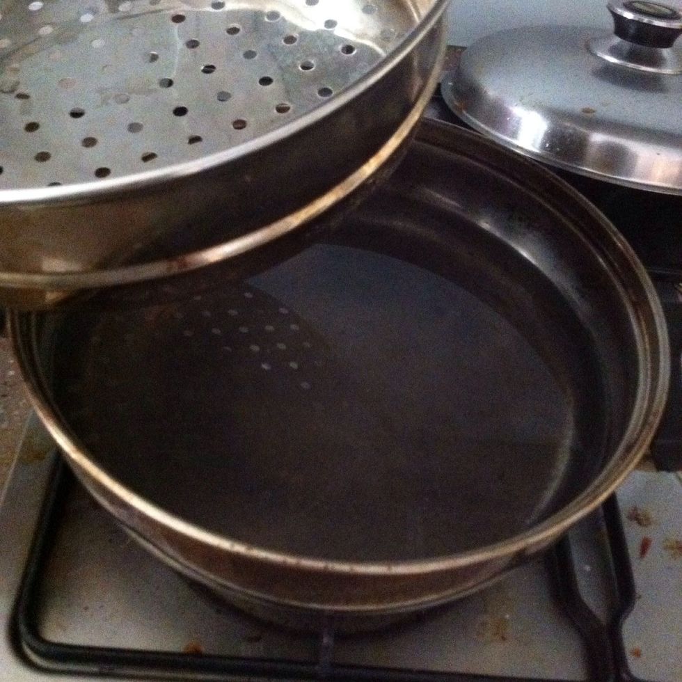 Prepare a steamer by adding water to the bottom compartment.