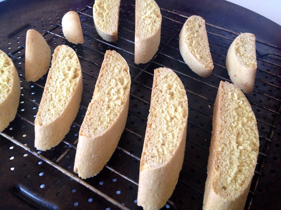 Prepare a wire rack and place over baking sheet. Cut logs diagonally into 1/2 inch slices and place pieces with cut side facing down on the wire rack.