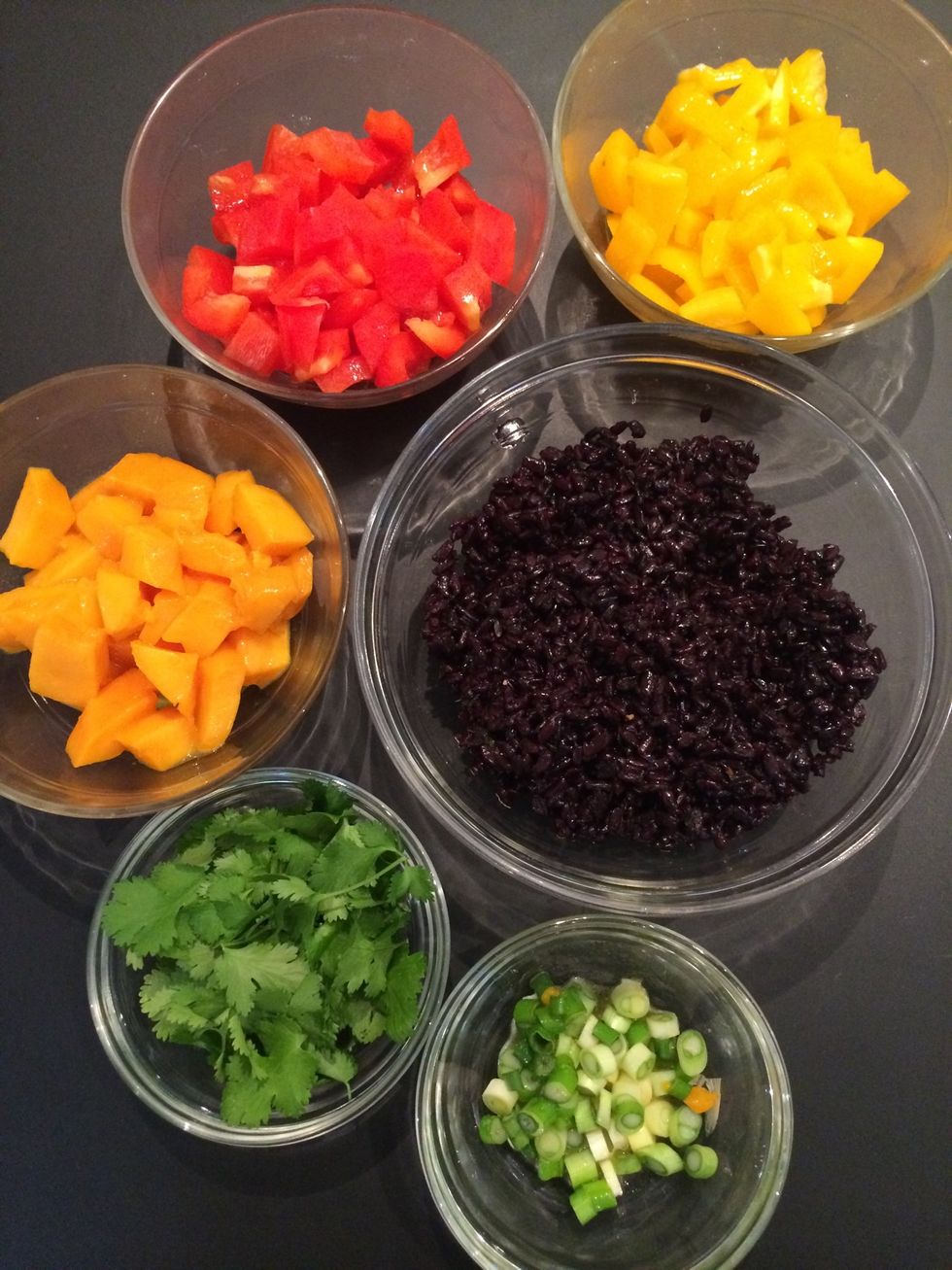 Prepare all the ingredients (ur choice) a precaution to take. Mix the dressing with the vegetables and the rice in separate bowls. ..to avoid the blackening of the vegetables by the rice