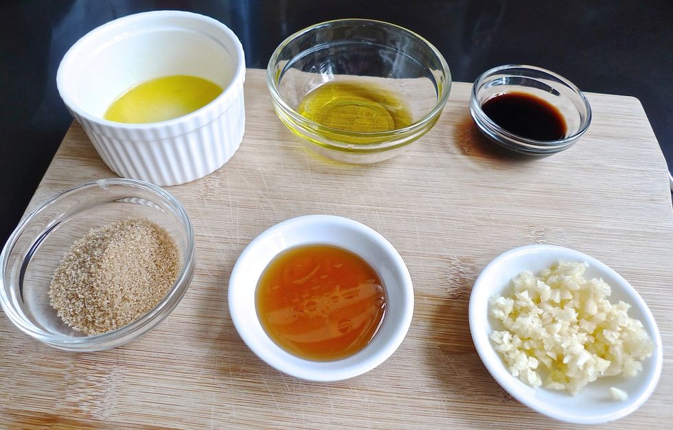 Prepare and measure ingredients to marinate the salmon fillets.