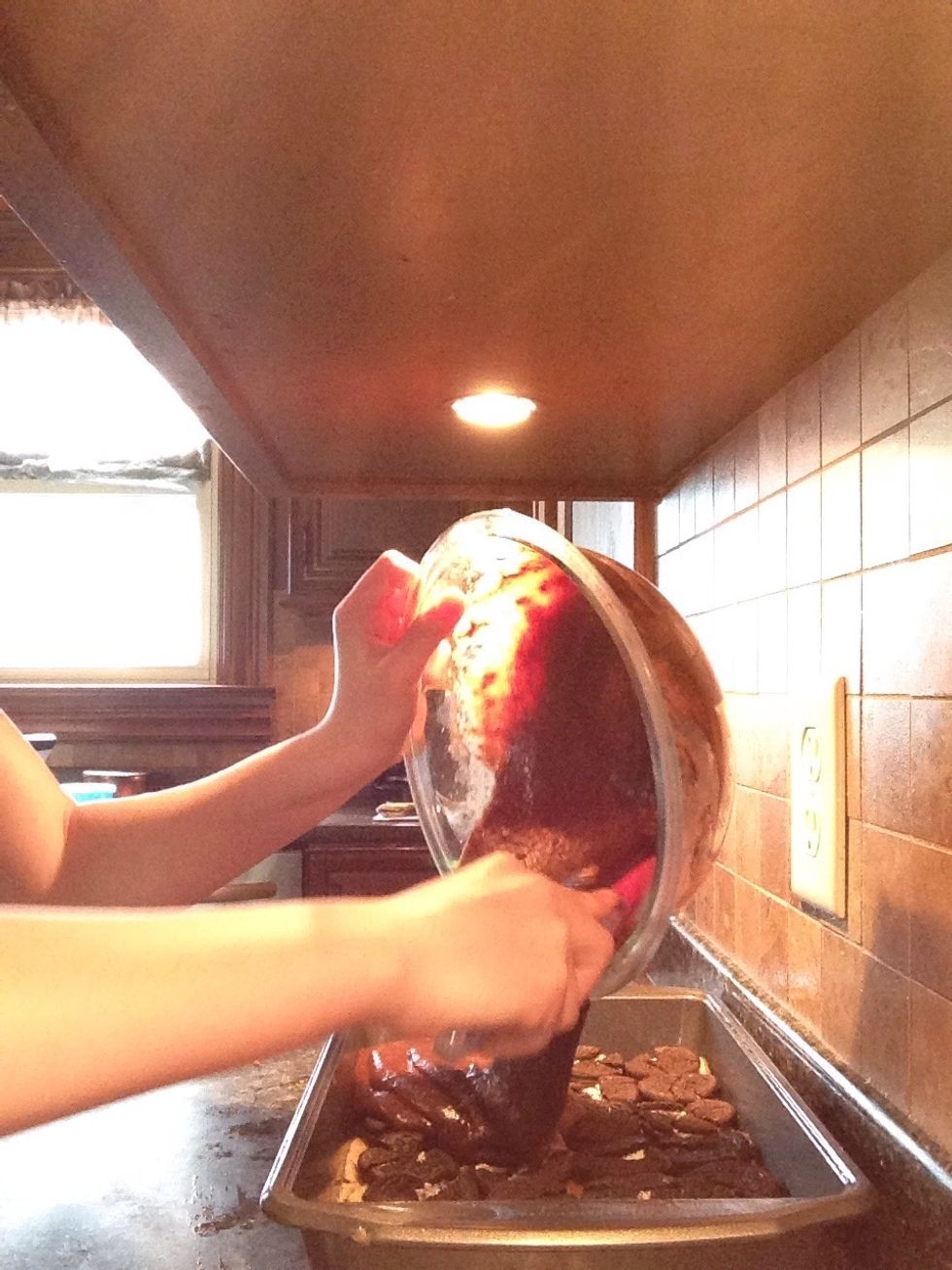 Prepare and pour your brownie mix over the cookie dough and Oreos.