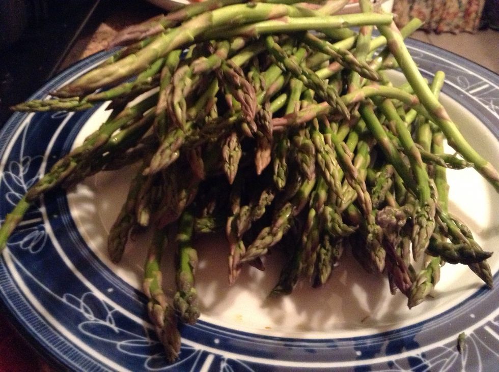 Prepare asparagus by snapping off hard ends and discarding -- wash off asparagus