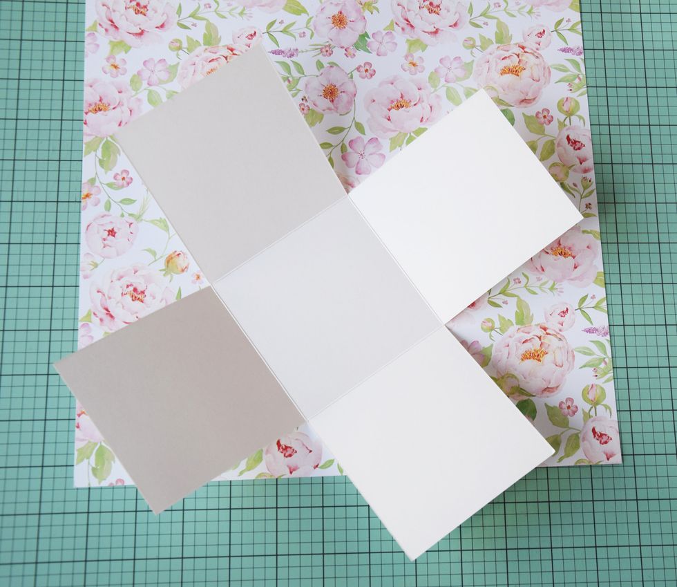 Prepare cardstock for base box - 12'' \u0445 12''. Fold it at 4'' and 8" on both sides. Cut the folded lines as it is shown on the picture.