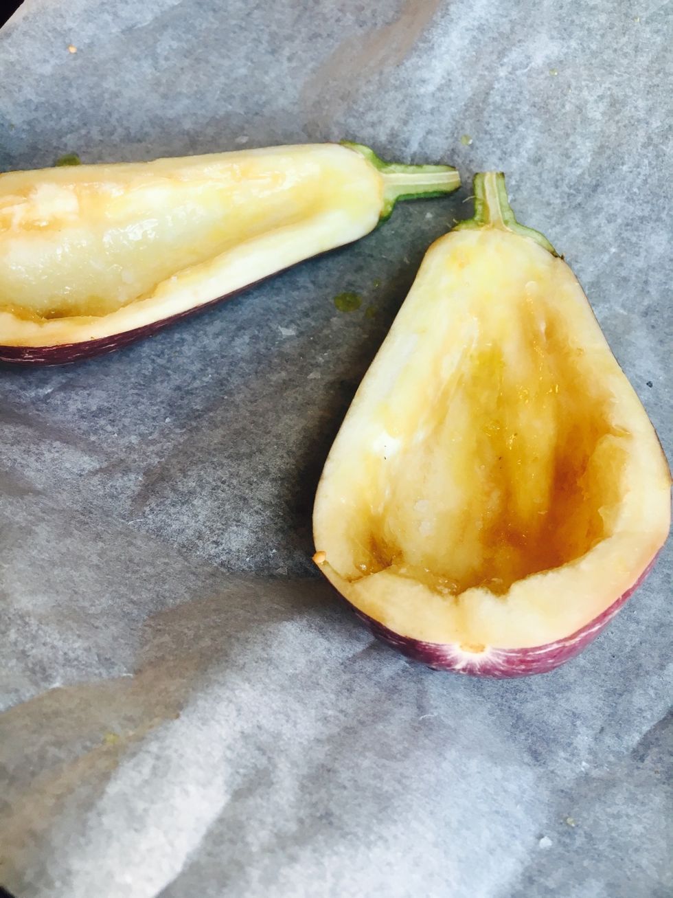 Prepare eggplant. Cut in half and take out the seeds. Brush with olive oil. Put in the oven when there's 15 mins left cooking for the chickpeas.