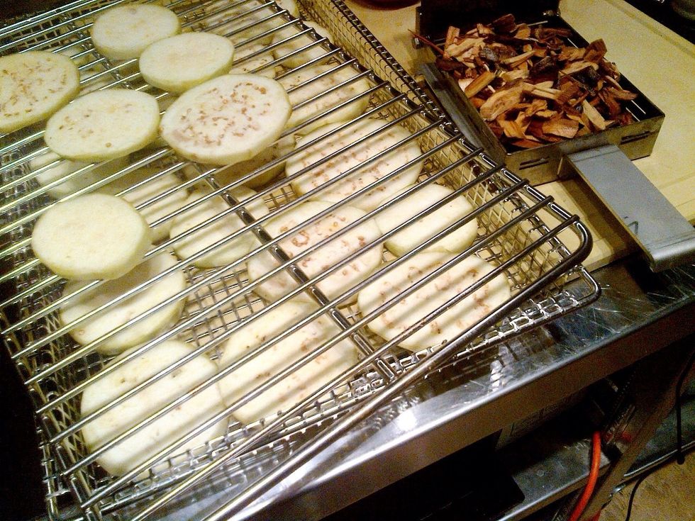 Prepare eggplant on smoking racks.