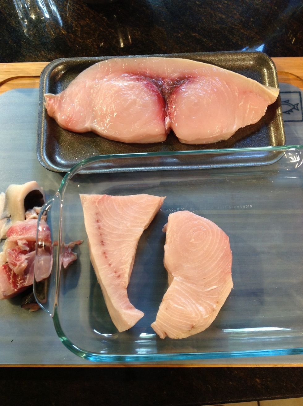 Prepare fish by trimming away skin and blood line.
