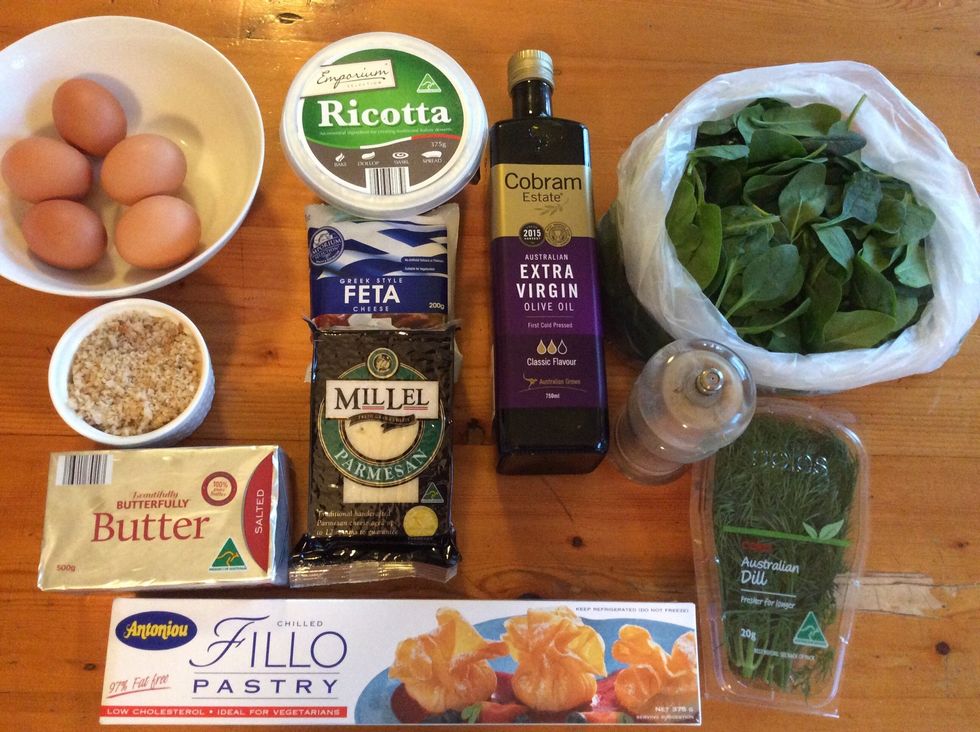 Prepare ingredients by getting them out and placing them on a bench or wherever you are making your spanakopita. Preheat your oven to 180\u00b0c.
