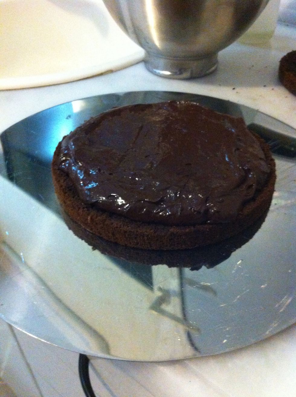 Prepare layers one by one. Use a spatula for spreading your frosting over the cake...