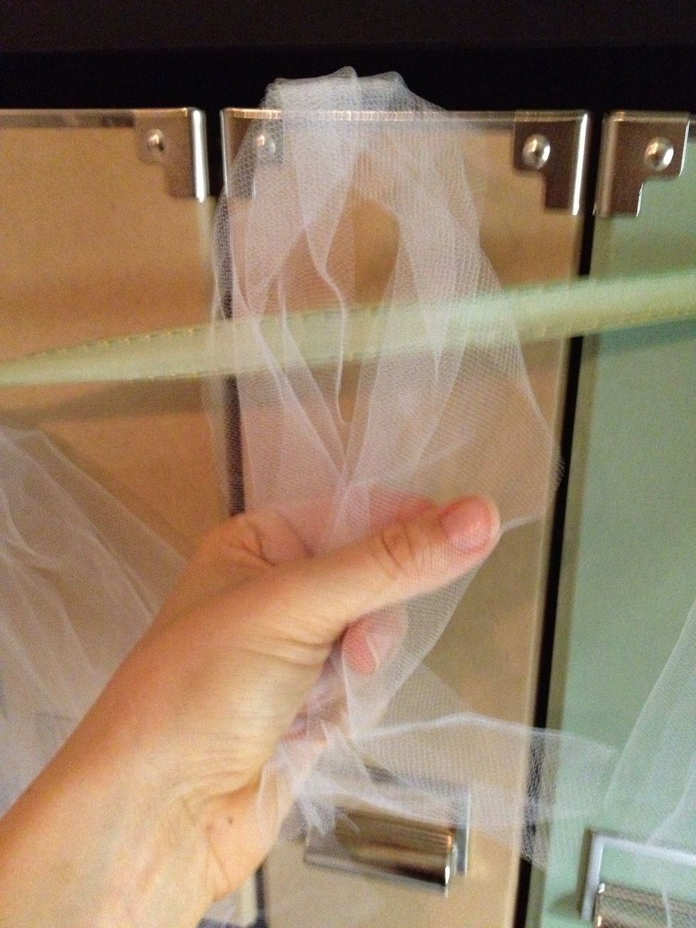 Prepare loop around ribbon. (I taped my ribbon up but you can tie it or pin it to a sewing board. )