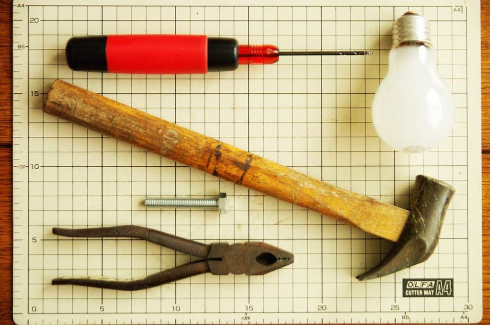 Prepare materials, burnt out the light bulb, pliers, a hammer, an awl, a bolt.