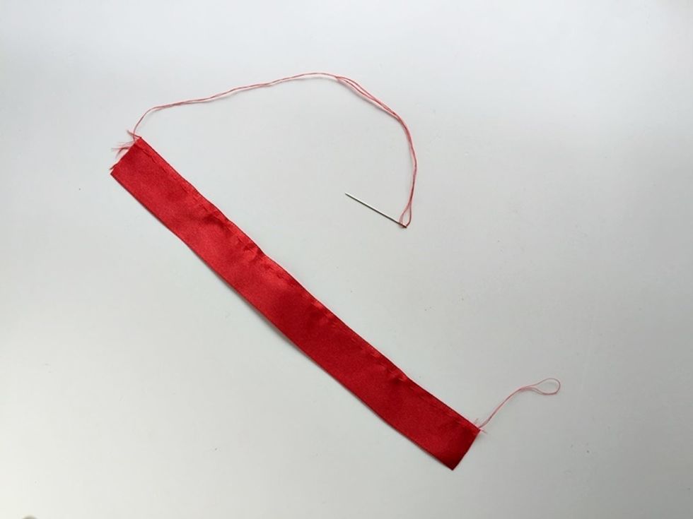 Prepare needle and thread. Do running stitches along any one side of the ribbons' length.