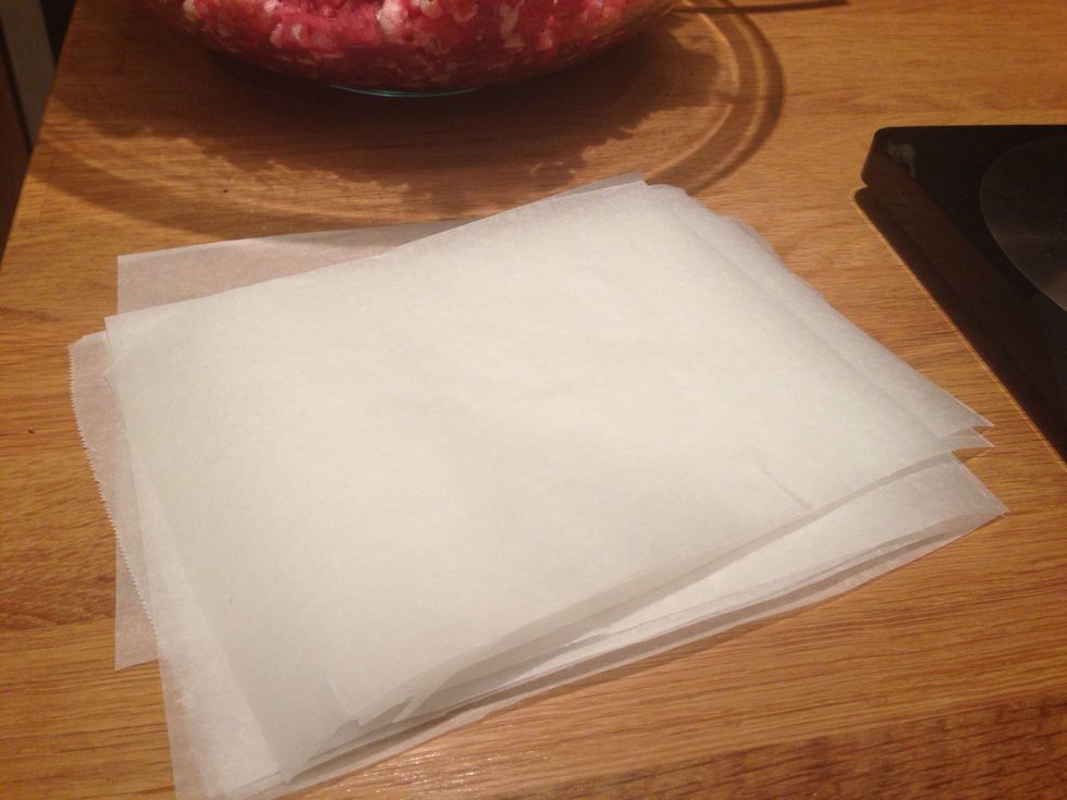 Prepare parchment paper squares, approximately 8x8 cm.