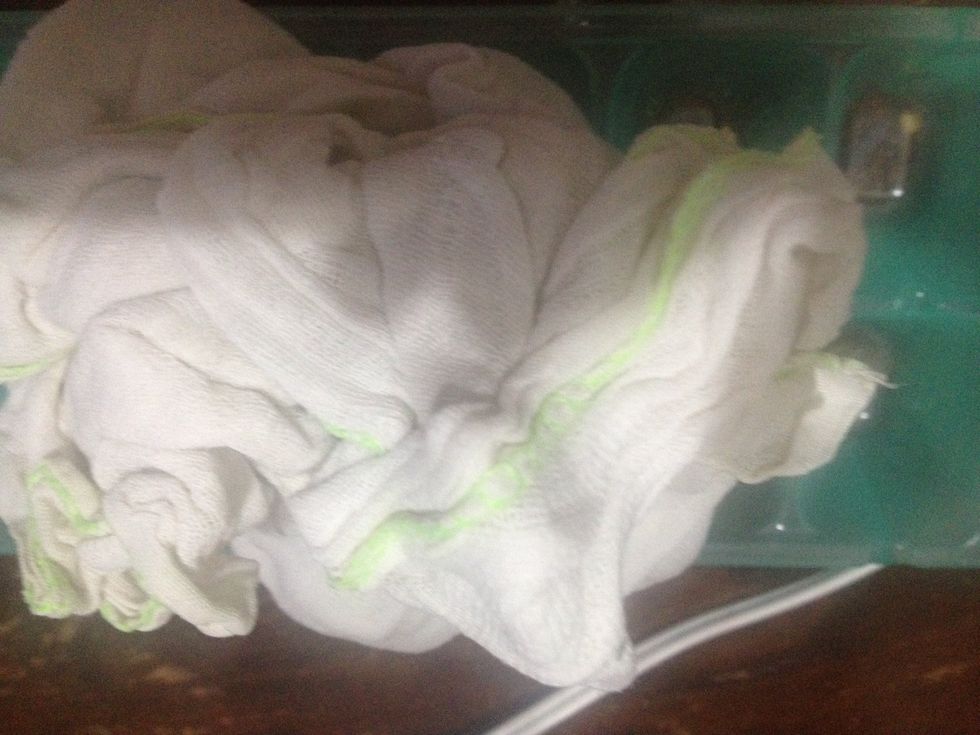 Prepare piece of cloth to wrap the ice cubes