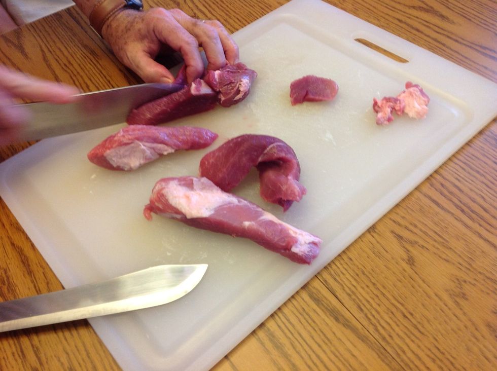 Prepare pork by removing fat