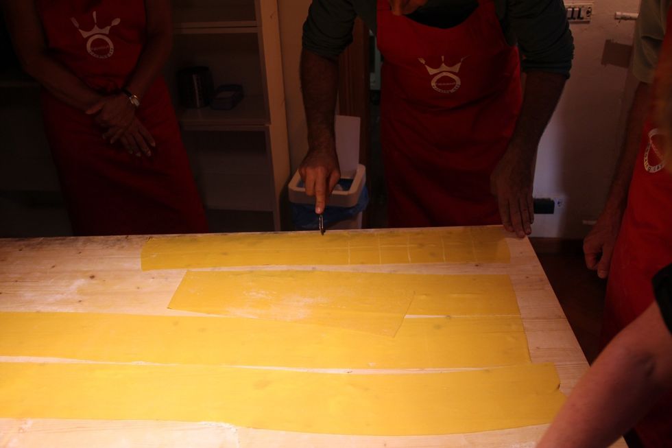 Prepare sheets of fresh pasta. Cut in squares