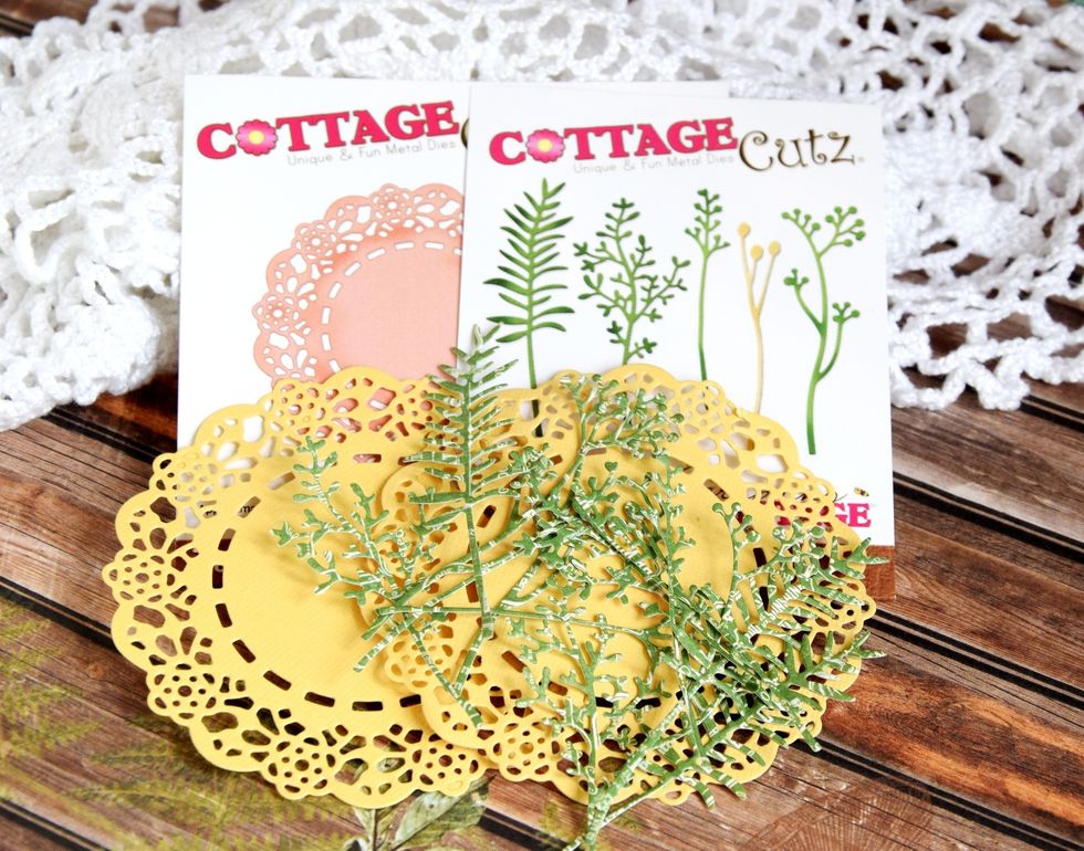 Prepare some die-cuts. With CottageCutz Garden Stems cut the details out with patterned paper. With CottageCutz Tea Time Doily (4x4) cut the details out with cardstock.