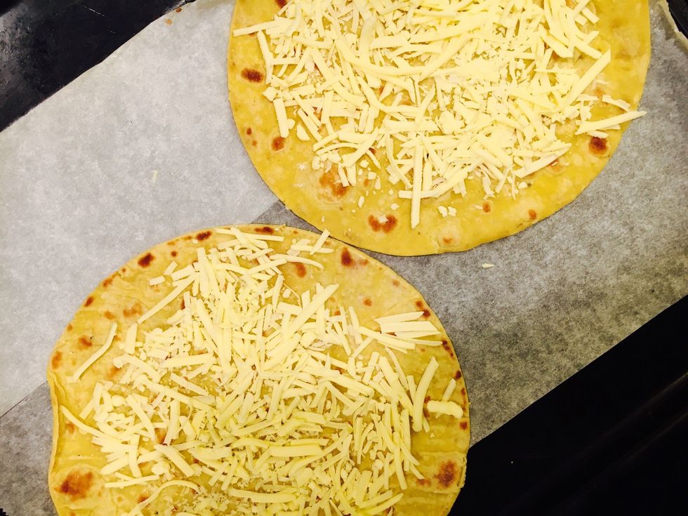 Prepare the corn tortillas. Add 1/2 of the vegan cheese to the bottom.