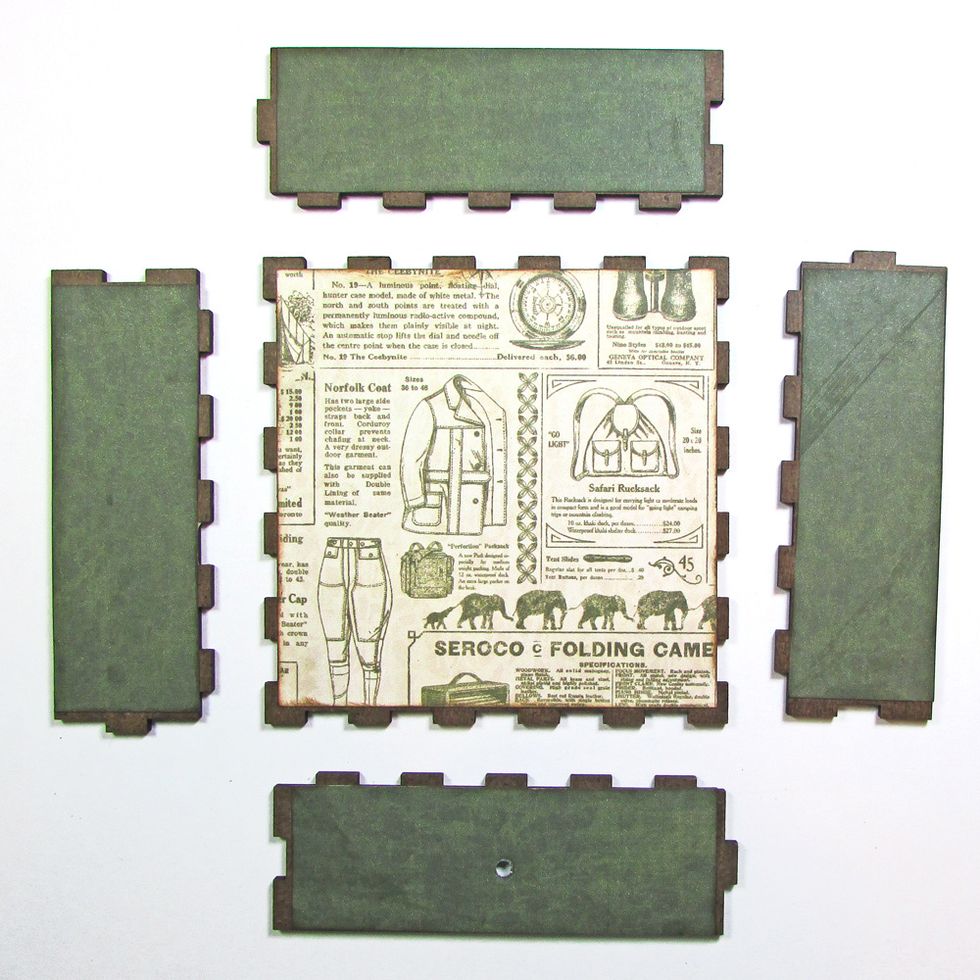 Prepare the drawer pieces and attach paper to the inside surface of each piece.