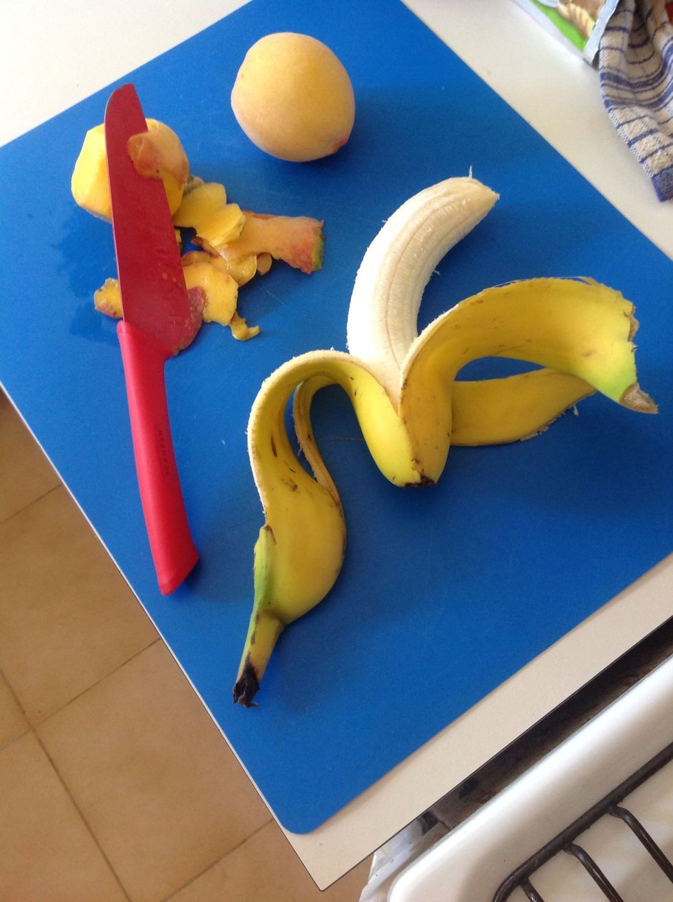 Prepare the fruit. Peel the banana and deseed any fruit that needs to be deseeded.