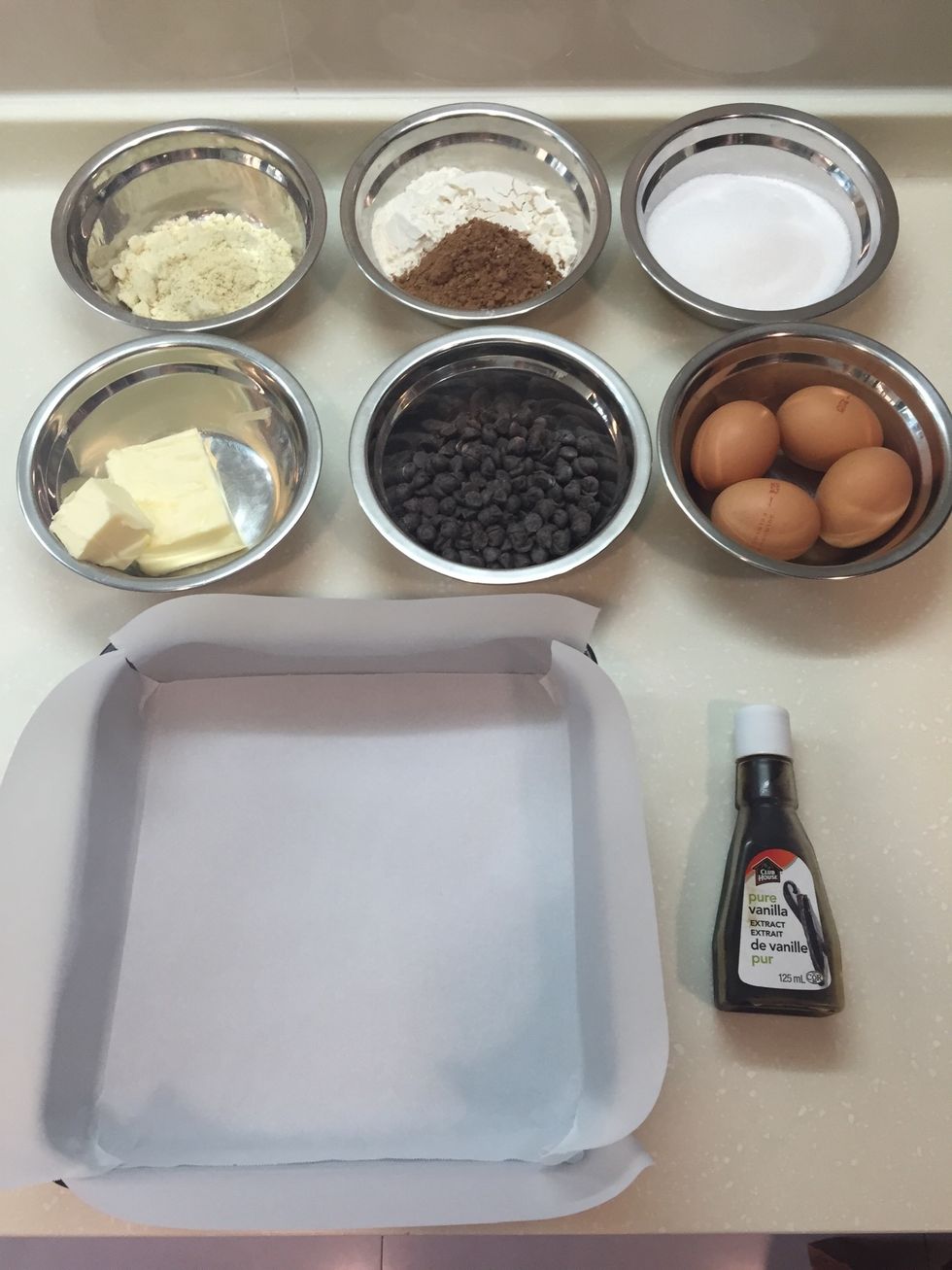 Prepare the ingredients. Line a baking tin with parchment paper. Preheat the oven to 180\u00b0C.