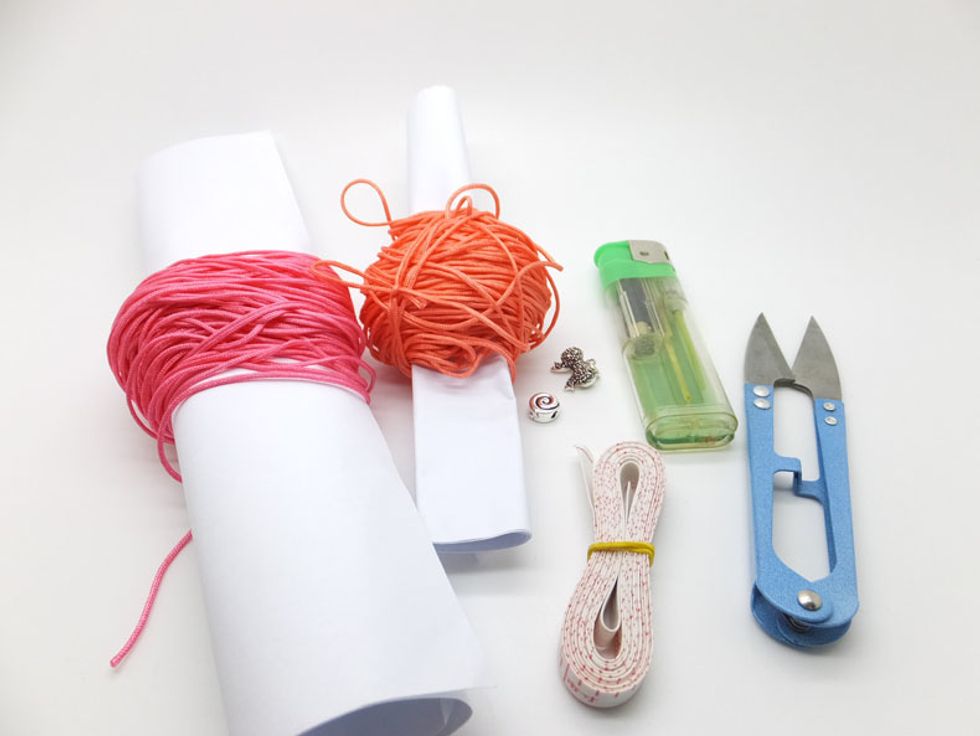 Prepare the Materials: 925 Sterling silver heart-shaped pendant X1 925 Sterling silver flat bead X1 No.72 Orange cord: 1 meters No.72 Pink cord: 2 meters Others:Scissor, Measuring tapes ,lighter