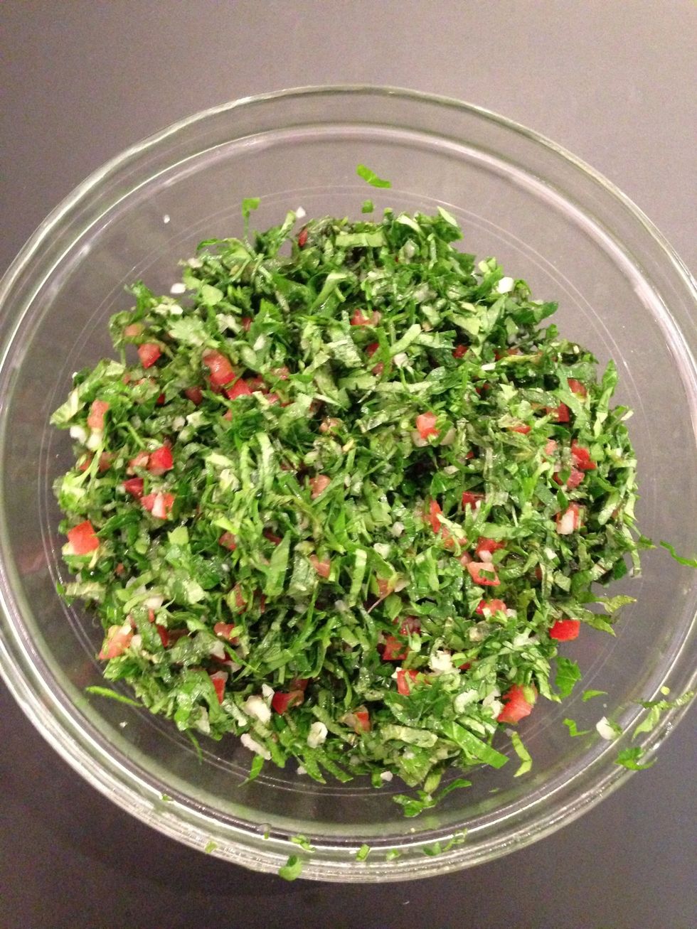 Prepare the stuffing. 2 bunches parsley, 1 bunch mint, 2 diced pnions 3 diced tomatoes. Mix. Add spices & salt + 2TBsp of olive oil & 1 lemon juice. Add the cooked garbanzo beans and the rice.