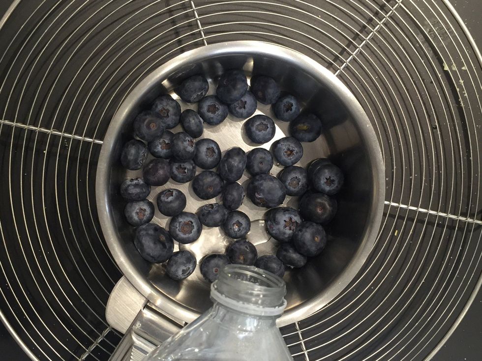 Prepare the syrup of  berries. Add 2-3 tbsp water over 200 g of bluberries