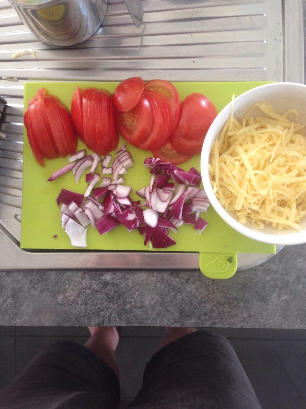Prepare tomatoes, onions and cheese