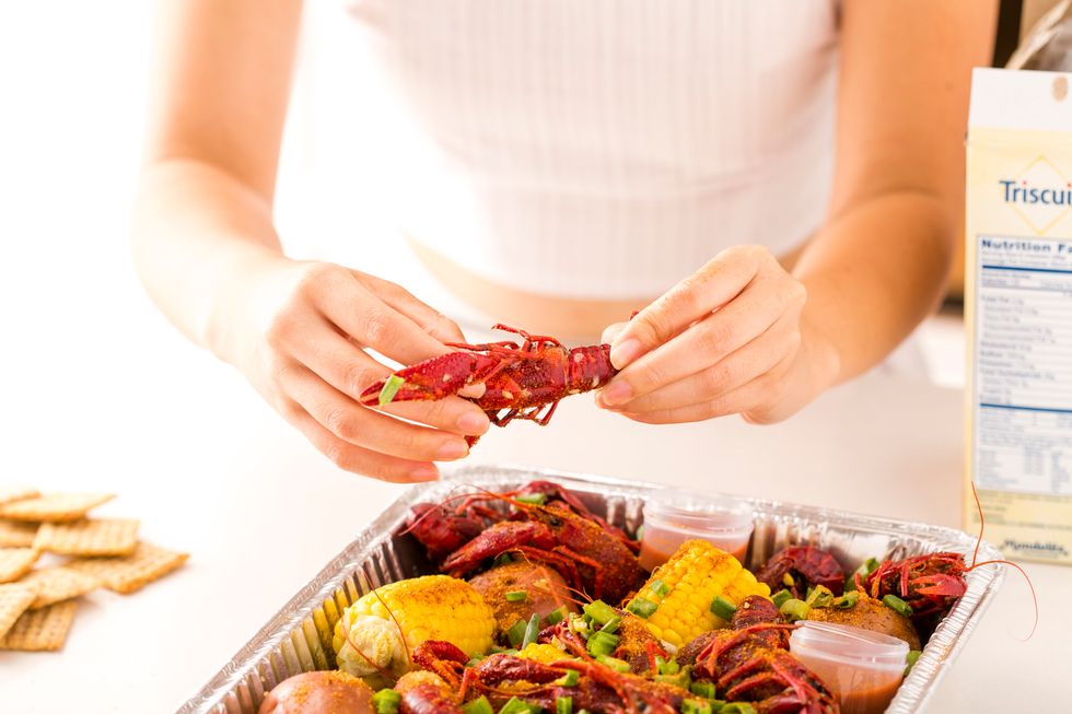 Prepare your crawfish by removing the meat from the shell.