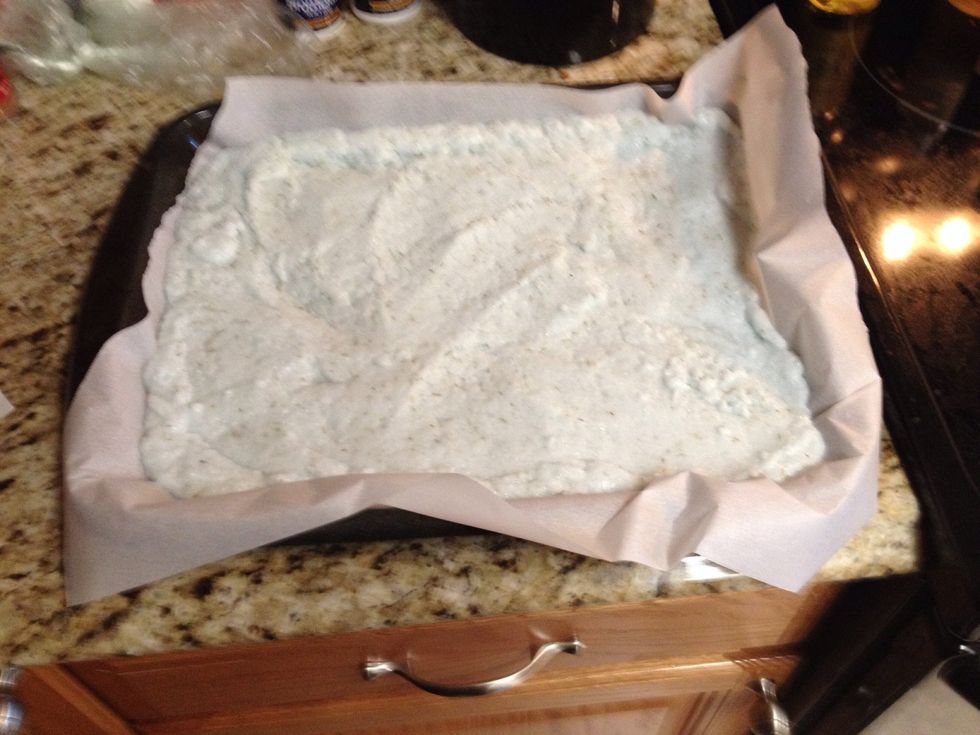 Prepare your flat cooking sheets by covering them with wax paper (you don't want these oils getting into your cooking pans, and it's easier to clean up). Spread the mix out on the pans, thin.