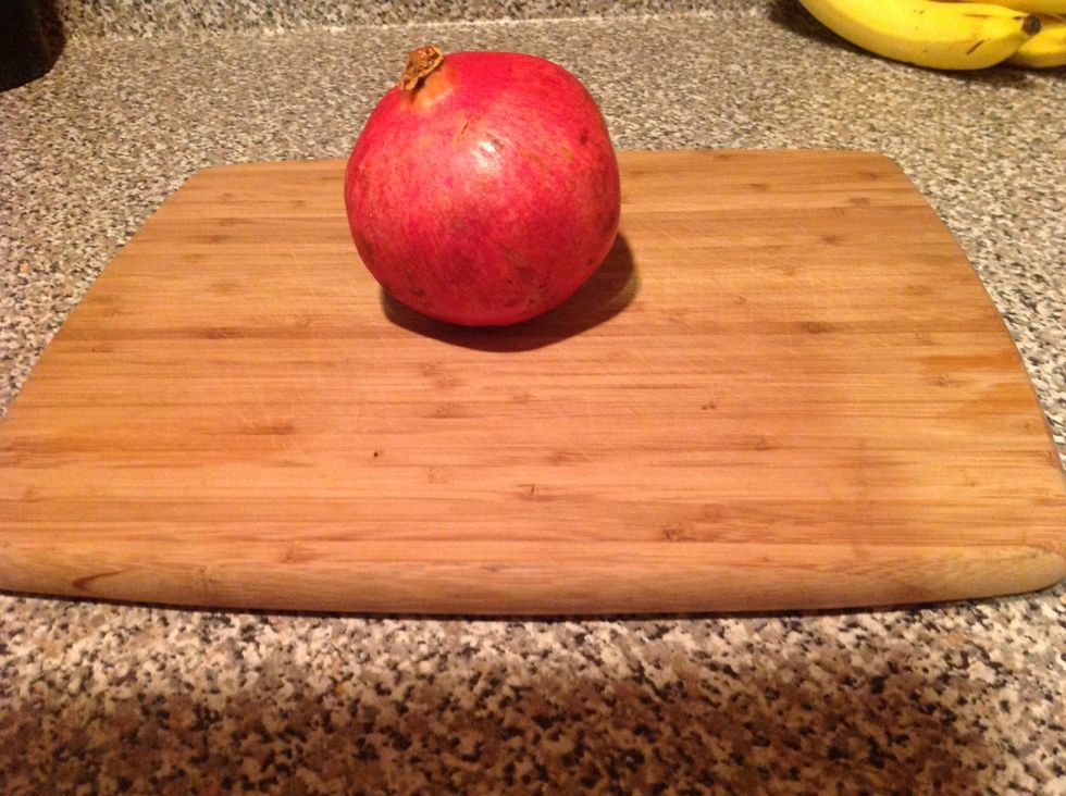 Prepare your pomegranate on a cutting board