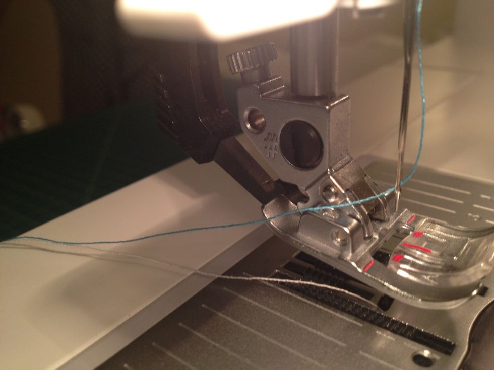 Prepare your sewing machine. Consider using a contrasting color on the top and use a thread color that will blend in on the back of the card.